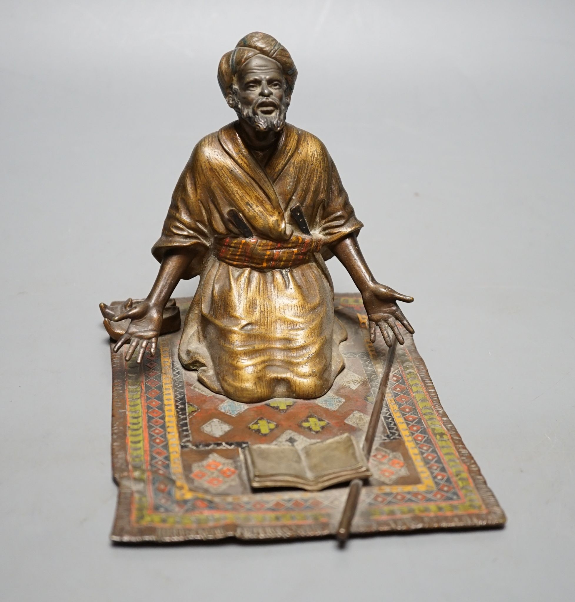 An enamelled, cold-painted bronze kneeling figure, unsigned, probably Franz Bergman, 16 cms deep x 13 cms high.